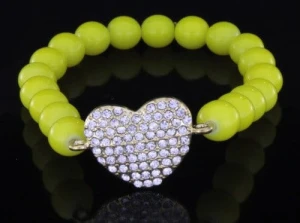 Neon yellow bracelet with heart on elastic